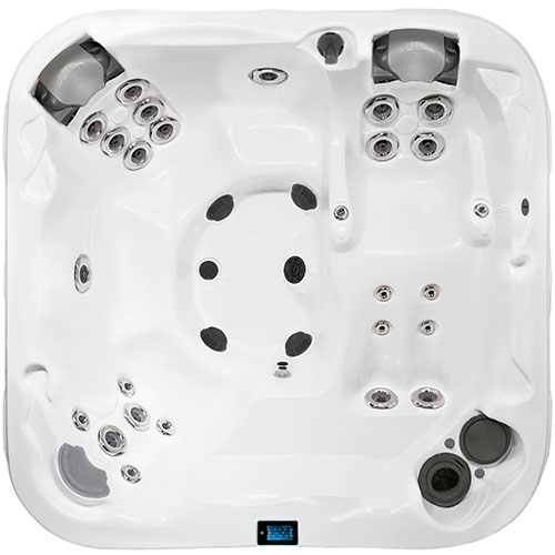 Overhead view of white hot tub with seats and multiple chrome jets